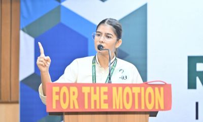 Speaker at Podium – For the Motion